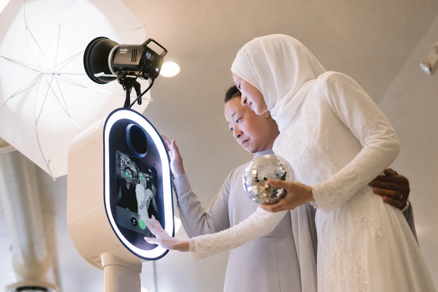 Bride choosing her shot on the booth screen